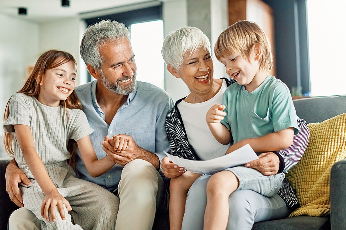 Portrait of grandparents and grandchildren having fun together at home