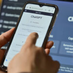 person using ChatGPT on their phone and computer