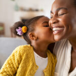 Daughter kisses her mother on Mother's Day