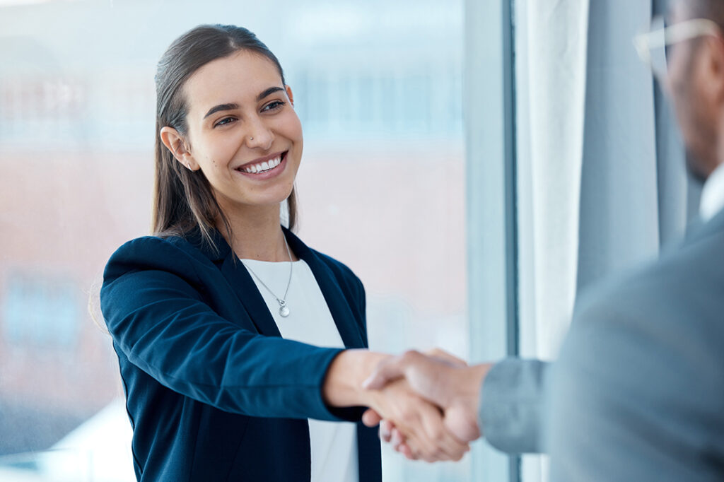 Colleagues display mutual respect by shaking hands