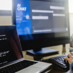 A programmer using generative artificial intelligence for software development inside an office