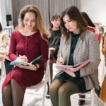 A group of women taking notes.