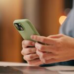 Close up on a hand holding a smartphone.