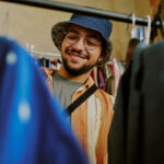 A young man thrift shopping