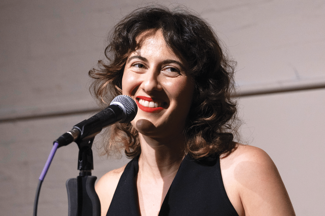 Jemma Rose Brown at a microphone