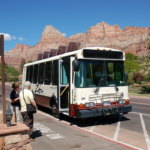 A National Parks Service solar bus picks up passengers.